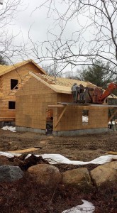 building applying OSB to garage roof, two-car garage, Timberhaven Log Homes, log homes, log cabin homes, log cabins, post and beam homes, timberframe homes, timber frame homes, laminated logs, engineered logs, floor plan designs, kiln dried logs, Flury Builders, Joe Walsh, Timberhaven local reps, log homes in Massachusetts, log homes in Rhode Island, MA, RI, log home builders