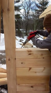 builder fastening logs together, solid log breezeway, Log Homes, log homes, log cabin homes, log cabins, post and beam homes, timberframe homes, timber frame homes, laminated logs, engineered logs, floor plan designs, kiln dried logs, Flury Builders, Joe Walsh, Timberhaven local reps, log homes in Massachusetts, log homes in Rhode Island, MA, RI, log home builders, solid log breezeway