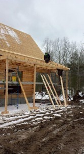 building shed porch on log home, outdoor living area, Timberhaven Log Homes, log homes, log cabin homes, log cabins, post and beam homes, timberframe homes, timber frame homes, laminated logs, engineered logs, floor plan designs, kiln dried logs, Flury Builders, Joe Walsh, Timberhaven local reps, log homes in Massachusetts, log homes in Rhode Island, MA, RI, log home builders