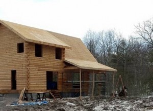 porching being built on log home that's under construction, outdoor living area, Timberhaven Log Homes, log homes, log cabin homes, log cabins, post and beam homes, timberframe homes, timber frame homes, laminated logs, engineered logs, floor plan designs, kiln dried logs, Flury Builders, Joe Walsh, Timberhaven local reps, log homes in Massachusetts, log homes in Rhode Island, MA, RI, log home builders