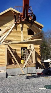 forklift lifting trusses into air, solid log breezeway, Log Homes, log homes, log cabin homes, log cabins, post and beam homes, timberframe homes, timber frame homes, laminated logs, engineered logs, floor plan designs, kiln dried logs, Flury Builders, Joe Walsh, Timberhaven local reps, log homes in Massachusetts, log homes in Rhode Island, MA, RI, log home builders, solid log breezeway