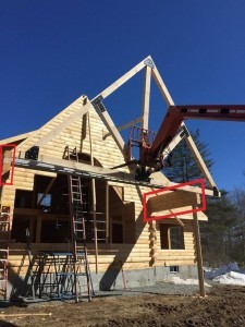 using forklift to elevate King Post Truss, outdoor living area, Timberhaven Log Homes, log homes, log cabin homes, log cabins, post and beam homes, timberframe homes, timber frame homes, laminated logs, engineered logs, floor plan designs, kiln dried logs, Flury Builders, Joe Walsh, Timberhaven local reps, log homes in Massachusetts, log homes in Rhode Island, MA, RI, log home builders