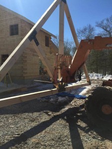 using forklift to elevate King Post Truss, outdoor living area, Timberhaven Log Homes, log homes, log cabin homes, log cabins, post and beam homes, timberframe homes, timber frame homes, laminated logs, engineered logs, floor plan designs, kiln dried logs, Flury Builders, Joe Walsh, Timberhaven local reps, log homes in Massachusetts, log homes in Rhode Island, MA, RI, log home builders