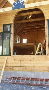 windows being installed in log home, windows and doors, Timberhaven Log Homes, log homes, log cabin homes, log cabins, post and beam homes, timberframe homes, timber frame homes, laminated logs, engineered logs, floor plan designs, kiln dried logs, Flury Builders, Joe Walsh, Timberhaven local reps, log homes in Massachusetts, log homes in Rhode Island, MA, RI, log home builders