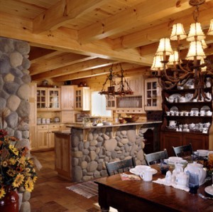 open kitchen and dining area of log home with exposed heavy timbers, log home flooring, Timberhaven Log Homes, log homes, log cabin homes, log cabins, post and beam homes, timberframe homes, timber frame homes, laminated logs, engineered logs, floor plan designs, kiln dried logs, Flury Builders, Joe Walsh, Timberhaven local reps, log homes in Massachusetts, log homes in Rhode Island, MA, RI, log home builders