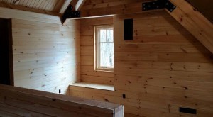 window seat and chase covered with tongue and groove in log home, Timberhaven Log Homes, log homes, log cabin homes, log cabins, post and beam homes, timberframe homes, timber frame homes, laminated logs, engineered logs, floor plan designs, kiln dried logs, Timberhaven local reps, , log home builders, log homes HVAC, HVAC options