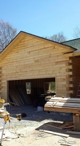 two car garage with log siding all the way gable end, log siding, Timberhaven Log Homes, log homes, log cabin homes, log cabins, post and beam homes, timberframe homes, timber frame homes, laminated logs, engineered logs, floor plan designs, kiln dried logs, Flury Builders, Joe Walsh, Timberhaven local reps, log homes in Massachusetts, log homes in Rhode Island, MA, RI, log home builders