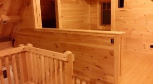 half wall by stairs completed with tongue and groove, Timberhaven Log Homes, log homes, log cabin homes, log cabins, post and beam homes, timberframe homes, timber frame homes, laminated logs, engineered logs, floor plan designs, kiln dried logs, Timberhaven local reps, log home builders, interior wall coverings, log homes in PA