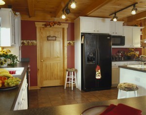 kitchen with dry wall and log wall combination, white kitchen cabinets, Log Homes, log homes, log cabin homes, log cabins, post and beam homes, timberframe homes, timber frame homes, laminated logs, engineered logs, floor plan designs, kiln dried logs, Timberhaven local reps, log home builders, interior wall coverings, log homes in PA