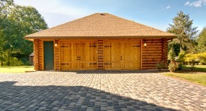 two car garage with half log siding, log siding, Timberhaven Log Homes, log homes, log cabin homes, log cabins, post and beam homes, timberframe homes, timber frame homes, laminated logs, engineered logs, floor plan designs, kiln dried logs, Flury Builders, Joe Walsh, Timberhaven local reps, log homes in Massachusetts, log homes in Rhode Island, MA, RI, log home builders