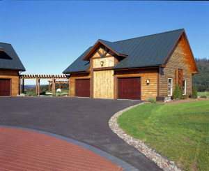 two car garage with trim corners, log siding, Timberhaven Log Homes, log homes, log cabin homes, log cabins, post and beam homes, timberframe homes, timber frame homes, laminated logs, engineered logs, floor plan designs, kiln dried logs, Flury Builders, Joe Walsh, Timberhaven local reps, log homes in Massachusetts, log homes in Rhode Island, MA, RI, log home builders