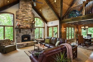 Interior, horizontal, living room toward fireplace and dining room, Timberhaven Log Homes, log homes, log cabin homes, log cabins, post and beam homes, timberframe homes, timber frame homes, laminated logs, engineered logs, floor plan designs, kiln dried logs, Timberhaven local reps, log home builders, interior wall coverings, log homes in PA