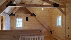 upstairs area of log home with heavy timber trusses, Timberhaven Log Homes, log homes, log cabin homes, log cabins, post and beam homes, timberframe homes, timber frame homes, laminated logs, engineered logs, floor plan designs, kiln dried logs, Timberhaven local reps, log home builders, interior wall coverings, log homes in PA