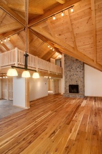 open greatroom looking at fireplace and ceiling design in post and beam home, log and timber homes, Timberhaven Log Homes, log homes, log cabin homes, log cabins, post and beam homes, timberframe homes, timber frame homes, laminated logs, engineered logs, floor plan designs, kiln dried logs, Timberhaven local reps, log homes in Pennsylvania, log homes in PA, PA homes, log home builder