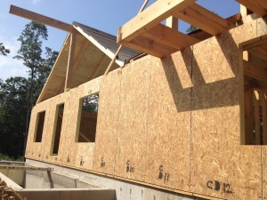 SIPS panels being installed on post and beam home, Name-brand components, Timberhaven Log Homes, log homes, log cabin homes, log cabins, post and beam homes, timberframe homes, timber frame homes, laminated logs, engineered logs, floor plan designs, kiln dried logs, Timberhaven local reps, log homes in PA, log home builders