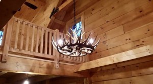 antler chandelier in log home, Name-brand components, Timberhaven Log Homes, Timberhaven Log and Timber Homes, log homes, log cabin homes, log cabins, post and beam homes, timberframe homes, timber frame homes, laminated logs, engineered logs, floor plan designs, kiln dried logs, Timberhaven local reps, log homes in PA, log home builders, kiln dried, interior finishes