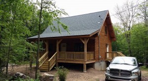 Light Pecan Outlast Q8 on exterior of log home, Protect your log home investment, treatment for log home, preservative maintenance, Log home kitchens, Timberhaven Log Homes, log homes, log cabin homes, log cabins, post and beam homes, timberframe homes, timber frame homes, laminated logs, engineered logs, floor plan designs, kiln dried logs, Timberhaven local reps, log homes in PA, log home builders