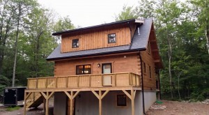 Light Pecan treatment to exterior of log home, Protect your log home investment, treatment for log home, preservative maintenance, Log home kitchens, Timberhaven Log Homes, log homes, log cabin homes, log cabins, post and beam homes, timberframe homes, timber frame homes, laminated logs, engineered logs, floor plan designs, kiln dried logs, Timberhaven local reps, log homes in PA, log home builders