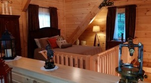 upstairs guest bedroom of log home, ultimate home, ultimate log home, Log home kitchens, Timberhaven Log Homes, log homes, log cabin homes, log cabins, post and beam homes, timberframe homes, timber frame homes, laminated logs, engineered logs, floor plan designs, kiln dried logs, Timberhaven local reps, log homes in PA, log home builders