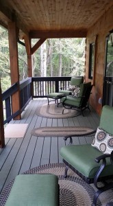 front porch with comfy seating and throw pillows, ultimate home, ultimate log home, Log home kitchens, Timberhaven Log Homes, log homes, log cabin homes, log cabins, post and beam homes, timberframe homes, timber frame homes, laminated logs, engineered logs, floor plan designs, kiln dried logs, Timberhaven local reps, log homes in PA, log home builders