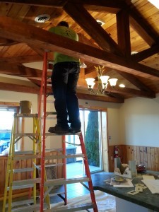 guy working on renovations in entryway, middleburg, PA, new home, Log home kitchens, Timberhaven Log Homes, log homes, log cabin homes, log cabins, post and beam homes, timberframe homes, timber frame homes, laminated logs, engineered logs, floor plan designs, kiln dried logs, Timberhaven local reps, log homes in PA, log home builders