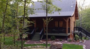 front entrance of log home in Pocono Mountains, Pennsylvania, ultimate home, ultimate log home, Log home kitchens, Timberhaven Log Homes, log homes, log cabin homes, log cabins, post and beam homes, timberframe homes, timber frame homes, laminated logs, engineered logs, floor plan designs, kiln dried logs, Timberhaven local reps, log homes in PA, log home builders