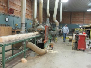 engineered log being planed at Timberhaven, new home, Log home kitchens, Timberhaven Log Homes, log homes, log cabin homes, log cabins, post and beam homes, timberframe homes, timber frame homes, laminated logs, engineered logs, floor plan designs, kiln dried logs, Timberhaven local reps, log homes in PA, log home builders