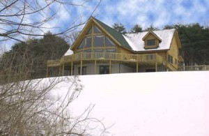 log home covered with snow, log home humidity levels, humidity levels, Log home kitchens, Timberhaven Log Homes, log homes, log cabin homes, log cabins, post and beam homes, timberframe homes, timber frame homes, laminated logs, engineered logs, floor plan designs, kiln dried logs, Timberhaven local reps, log homes in PA, log home builders