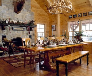 dining room table and fireplace in log home, Log home Christmas, Timberhaven Log Homes, Timberhaven Log & Timber Homes, log homes, log cabin homes, log cabins, post and beam homes, timberframe homes, timber frame homes, laminated logs, engineered logs, floor plan designs, kiln dried logs, Timberhaven local reps, log homes in PA