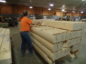 guy sorting logs, pre-sorted logs, log homes, log cabin homes, log cabins, post and beam homes, timberframe homes, timber frame homes, laminated logs, engineered logs, floor plan designs, kiln dried logs, Timberhaven local reps, log homes in Pennsylvania, log homes in PA, Timberhaven Log Homes, Timberhaven Log & Timber Homes