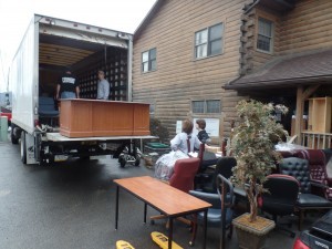 group loading furniture onto truck, office relocation, log homes, log cabin homes, log cabins, post and beam homes, timberframe homes, timber frame homes, laminated logs, engineered logs, floor plan designs, kiln dried logs, Timberhaven local reps, log homes in Pennsylvania, log homes in PA, Timberhaven Log Homes, Timberhaven Log & Timber Homes