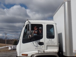 guy waving from big truck, office relocation, log homes, log cabin homes, log cabins, post and beam homes, timberframe homes, timber frame homes, laminated logs, engineered logs, floor plan designs, kiln dried logs, Timberhaven local reps, log homes in Pennsylvania, log homes in PA, Timberhaven Log Homes, Timberhaven Log & Timber Homes