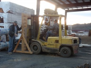 forklift moving log dispaly, making great progress, log homes, log cabin homes, log cabins, post and beam homes, timberframe homes, timber frame homes, laminated logs, engineered logs, floor plan designs, kiln dried logs, Timberhaven local reps, log homes in Pennsylvania, log homes in PA, Timberhaven Log Homes, Timberhaven Log & Timber Homes