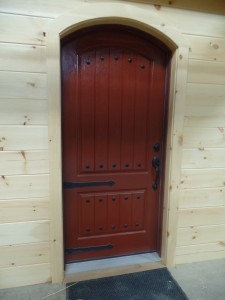 Log wall with Therma Tru door, making great progress, log homes, log cabin homes, log cabins, post and beam homes, timberframe homes, timber frame homes, laminated logs, engineered logs, floor plan designs, kiln dried logs, Timberhaven local reps, log homes in Pennsylvania, log homes in PA, Timberhaven Log Homes, Timberhaven Log & Timber Homes