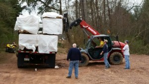 log packs being unloaded off truck with forklife, delivery day, log homes, log cabin homes, log cabins, post and beam homes, timberframe homes, timber frame homes, laminated logs, engineered logs, floor plan designs, kiln dried logs, Timberhaven local reps, log homes in Pennsylvania, log homes in PA, Timberhaven Log Homes, Timberhaven Log & Timber Homes