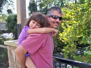 daughter being carried on father's back, Ken Holmes, employee spotlight, Timberhaven Log & Timber Homes, Timberhaven, log homes, Middleburg, PA