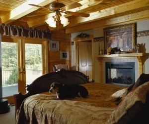 dog resting on bed in log home, canines in your log home design, log homes, log cabin homes, log cabins, post and beam homes, timberframe homes, timber frame homes, laminated logs, engineered logs, floor plan designs, kiln dried logs, Timberhaven local reps, log homes in Pennsylvania, log homes in PA, Timberhaven Log Homes, Timberhaven Log & Timber Homes