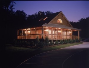 log home in the dusk with lots of lights, harrisburg log home package, log homes, log cabin homes, log cabins, post and beam homes, timberframe homes, timber frame homes, laminated logs, engineered logs, floor plan designs, kiln dried logs, Timberhaven local reps, log homes in Pennsylvania, log homes in PA, Timberhaven Log Homes, Timberhaven Log & Timber Homes