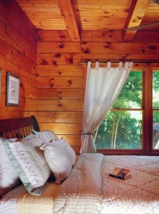 bedroom of a log home, mountain view log home package, log homes, log cabin homes, log cabins, post and beam homes, timberframe homes, timber frame homes, laminated logs, engineered logs, floor plan designs, kiln dried logs, Timberhaven local reps, log homes in Pennsylvania, log homes in PA, Timberhaven Log Homes, Timberhaven Log & Timber Homes