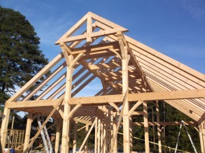 timber frame structure being built, handcrafter talks timber frame