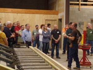 group of people watching a demonstration, Timberhaven Log & Timber Homes logo, educational seminar, log homes, log cabin homes, log cabins, post and beam homes, timberframe homes, timber frame homes, laminated logs, engineered logs, floor plan designs, kiln dried logs, Timberhaven local reps, log homes in Pennsylvania, log homes in PA, Timberhaven Log Homes, Timberhaven Log & Timber Homes