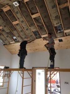 two working installing tongue and groove on ceiling, Bitter sweet dream home, log homes, log cabin homes, log cabins, post and beam homes, timberframe homes, timber frame homes, laminated logs, engineered logs, floor plan designs, kiln dried logs, Timberhaven local reps, log homes in Pennsylvania, log homes in PA, Timberhaven Log Homes, Timberhaven Log & Timber Homes