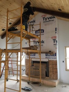 guy installing beam on ceiling, Bitter sweet dream home, log homes, log cabin homes, log cabins, post and beam homes, timberframe homes, timber frame homes, laminated logs, engineered logs, floor plan designs, kiln dried logs, Timberhaven local reps, log homes in Pennsylvania, log homes in PA, Timberhaven Log Homes, Timberhaven Log & Timber Homes