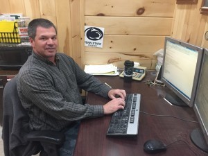 picture of employee working on computer, andrew harter, log homes, log cabin homes, log cabins, post and beam homes, timberframe homes, timber frame homes, laminated logs, engineered logs, floor plan designs, kiln dried logs, Timberhaven local reps, log homes in Pennsylvania, log homes in PA, Timberhaven Log Homes, Timberhaven Log & Timber Homes