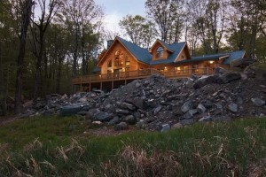 a log home on a rock embankment, log home living, log homes, log cabin homes, log cabins, post and beam homes, timberframe homes, timber frame homes, laminated logs, engineered logs, floor plan designs, kiln dried logs, Timberhaven local reps, log homes in Pennsylvania, log homes in PA, Timberhaven Log Homes, Timberhaven Log & Timber Homes