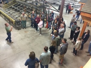 group looking at speaker, construction seminar, laminated logs, engineered logs, lamination process, log homes, timber frame homes, Timberhaven
