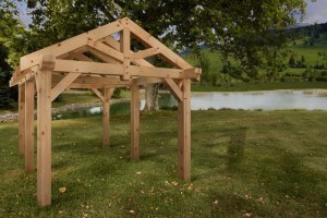 timber frame pavilion by a pond, product display areas, timber frame display, timber frame pavilion, timber frame outdoor wooden structures