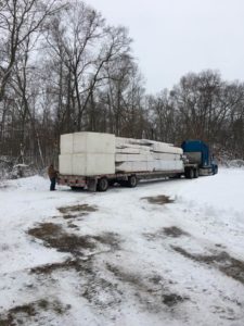 tractor trailer truck loaded with materials, built in the winter, log home winter, building a log home in the winter, building a timber frame home in the winter, Timberhaven