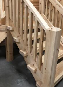 timber pegged stair systems, Half log handcrafted stair systems, custom stairs in log home, stair systems, wooden stair systems, custom stair systems, custom stairs, wooden stairs, Timberhaven stair options