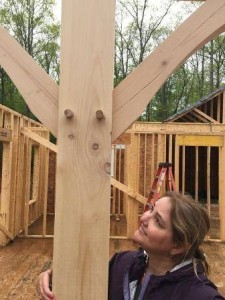 woman admiring a timber post, Log Home Living Lifestyle, timber frame home lifestyle, log home living, timber frame home living, Timberhaven, log home living lifestyle